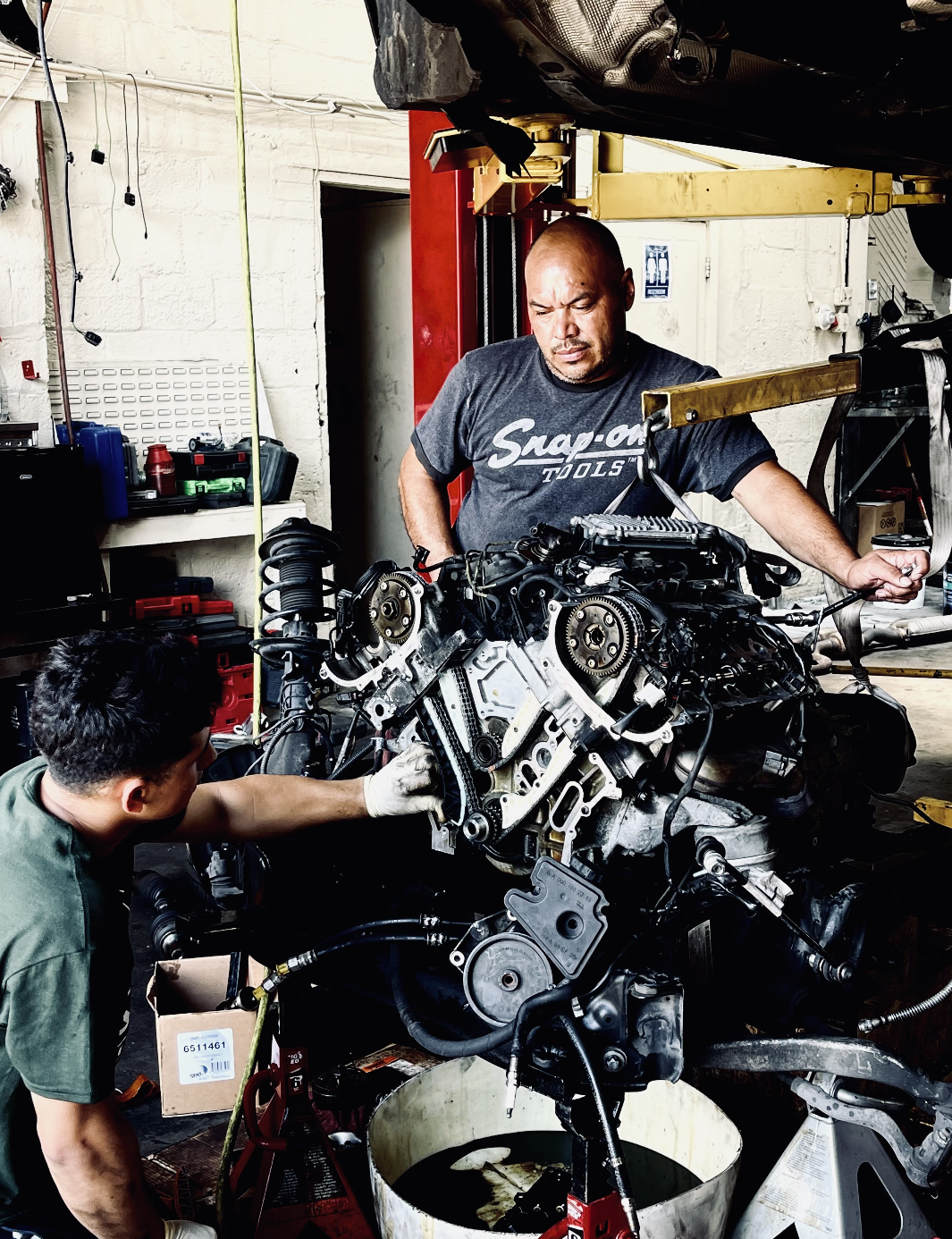 Technician inspecting an engine bay
